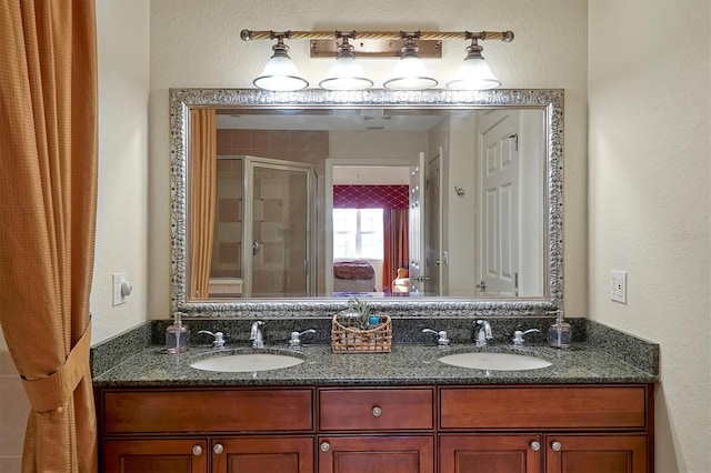 7616 Cabana Ct Unit 301, Reunion, FL 34747 - full bathroom with double vanity, a shower stall, and a textured wall