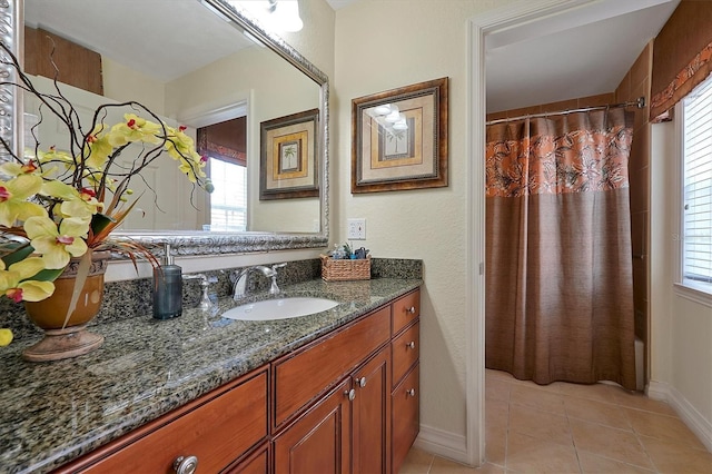 7616 Cabana Ct Unit 301, Reunion, FL 34747 - full bathroom with vanity, tile patterned floors, and shower / bath combination with curtain