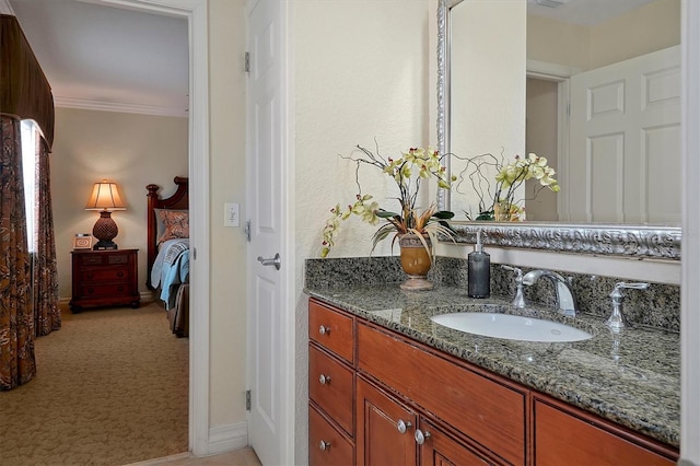 7616 Cabana Ct Unit 301, Reunion, FL 34747 - bathroom featuring vanity, connected bathroom, and ornamental molding