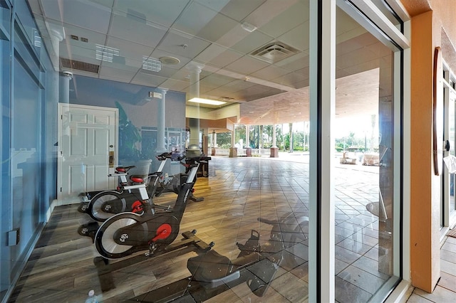 7616 Cabana Ct Unit 301, Reunion, FL 34747 - gym featuring a drop ceiling and wood finished floors