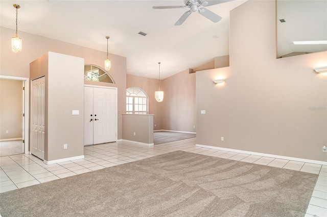 924 Texas St, Englewood, FL 34223 - tiled foyer entrance with ceiling fan, high vaulted ceiling, and baseboards