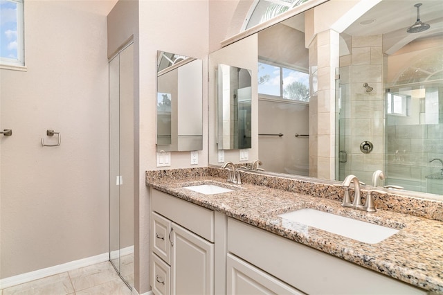 924 Texas St, Englewood, FL 34223 - bathroom with baseboards, a shower stall, and double vanity
