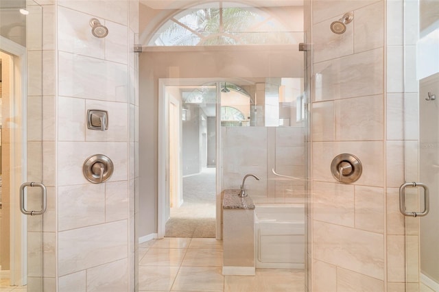 924 Texas St, Englewood, FL 34223 - bathroom featuring a shower stall, a garden tub, and tile patterned floors
