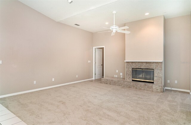 924 Texas St, Englewood, FL 34223 - unfurnished living room featuring ceiling fan, a tile fireplace, carpet, baseboards, and recessed lighting
