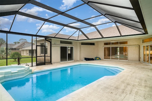 924 Texas St, Englewood, FL 34223 - view of pool featuring a patio, a pool with connected hot tub, and glass enclosure