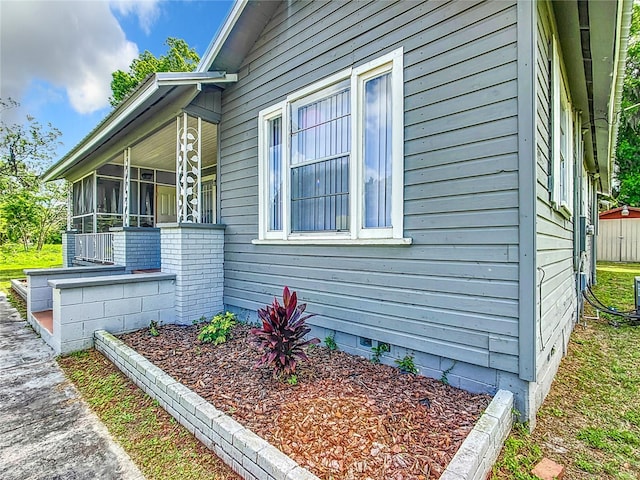 1826 W Silver Springs Blvd, Ocala, FL 34475 - view of property exterior featuring crawl space and a sunroom