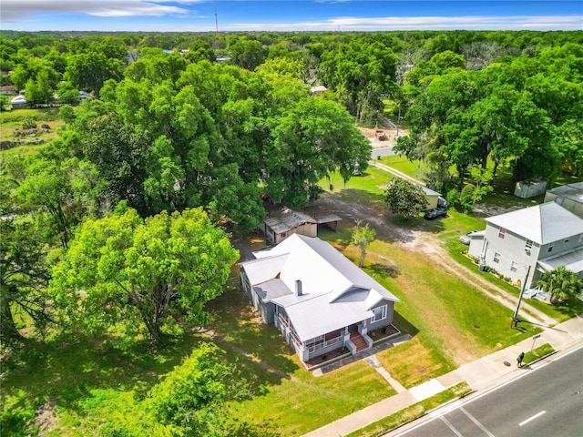 1826 W Silver Springs Blvd, Ocala, FL 34475 - aerial view of property and surrounding area featuring a heavily wooded area