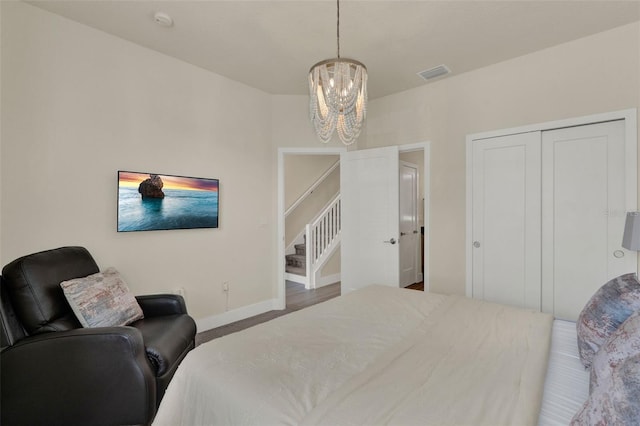 17441 Hidden Forest Dr, Clermont, FL 34714 - bedroom featuring a chandelier, a closet, baseboards, and carpet floors