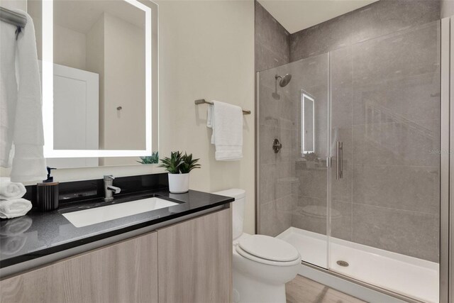 17441 Hidden Forest Dr, Clermont, FL 34714 - bathroom featuring toilet, vanity, and a stall shower