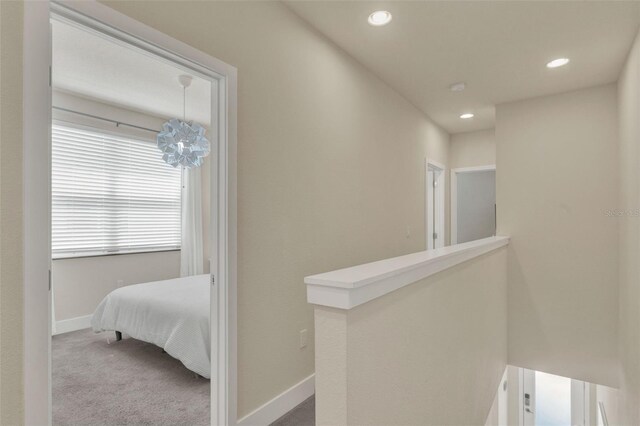 17441 Hidden Forest Dr, Clermont, FL 34714 - hall with carpet flooring, recessed lighting, baseboards, a chandelier, and an upstairs landing