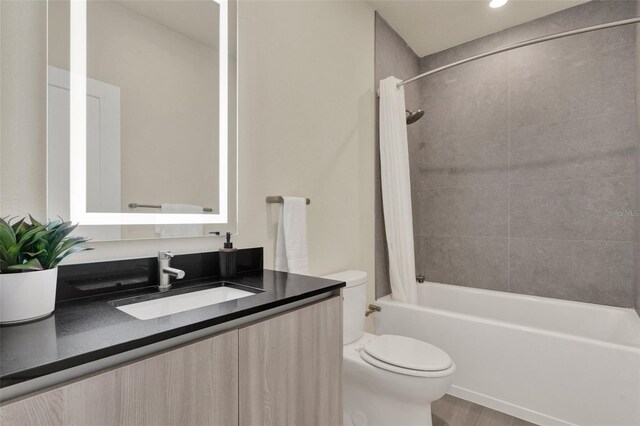 17441 Hidden Forest Dr, Clermont, FL 34714 - bathroom with toilet, vanity, shower / bath combination with curtain, and wood finished floors