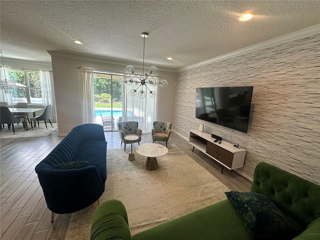 14117 Larkspur Lake Dr, Winter Garden, FL 34787 - living room with ornamental molding, a chandelier, wood finished floors, a textured ceiling, and recessed lighting