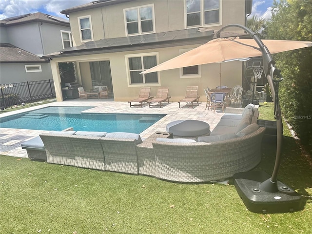 14117 Larkspur Lake Dr, Winter Garden, FL 34787 - rear view of house featuring stucco siding, a patio, and outdoor lounge area