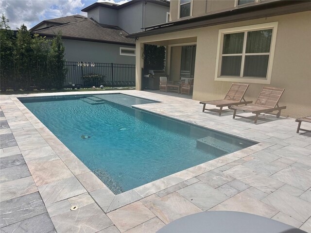 14117 Larkspur Lake Dr, Winter Garden, FL 34787 - view of swimming pool with a patio area