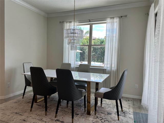 14117 Larkspur Lake Dr, Winter Garden, FL 34787 - dining area with a chandelier, plenty of natural light, ornamental molding, baseboards, and wood finished floors