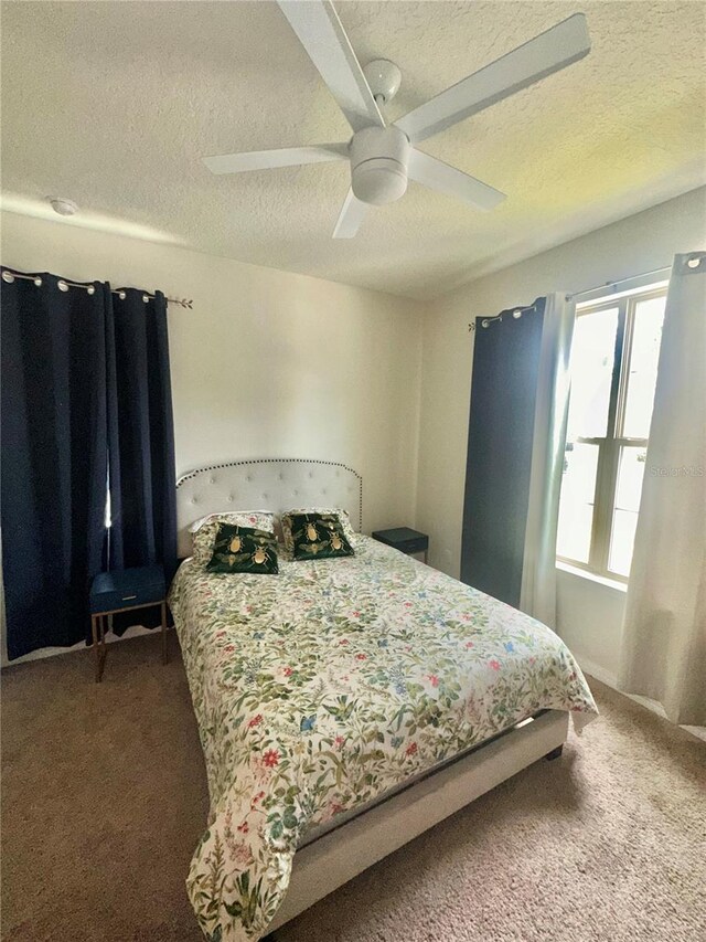 14117 Larkspur Lake Dr, Winter Garden, FL 34787 - carpeted bedroom featuring a textured ceiling and ceiling fan
