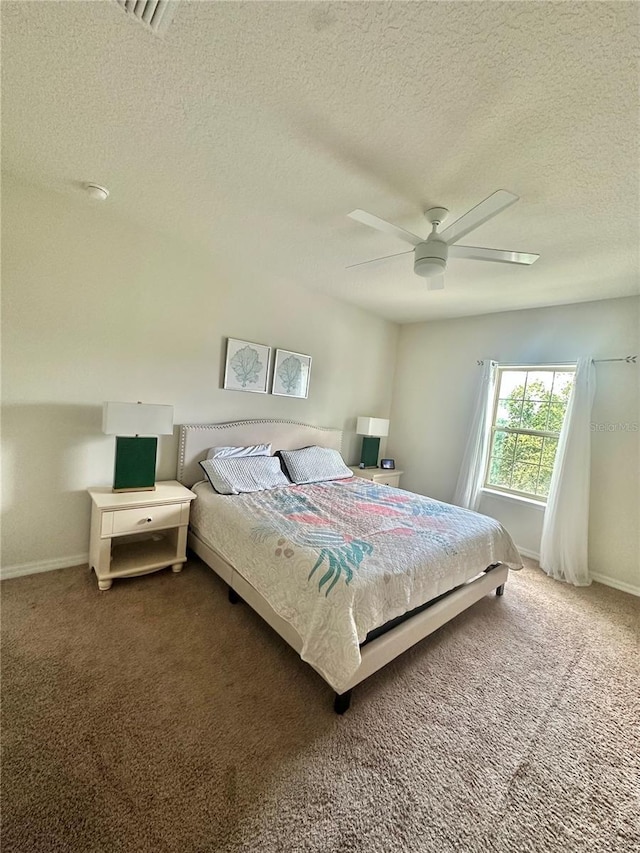 14117 Larkspur Lake Dr, Winter Garden, FL 34787 - bedroom with a textured ceiling, carpet floors, baseboards, and a ceiling fan
