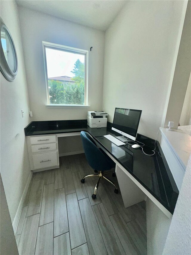 14117 Larkspur Lake Dr, Winter Garden, FL 34787 - office with light wood-type flooring, built in study area, and baseboards