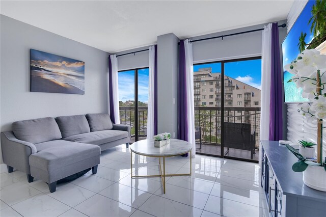 6165 Carrier Dr Unit 2605, Orlando, FL 32819 - living room featuring a wall of windows