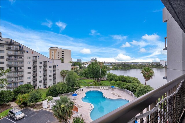 6165 Carrier Dr Unit 2605, Orlando, FL 32819 - community pool featuring a water view and a patio