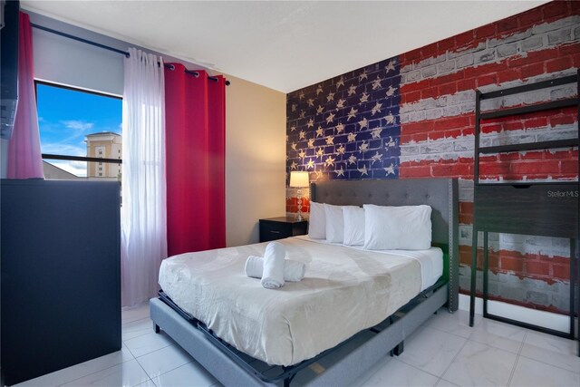 6165 Carrier Dr Unit 2605, Orlando, FL 32819 - bedroom featuring an accent wall