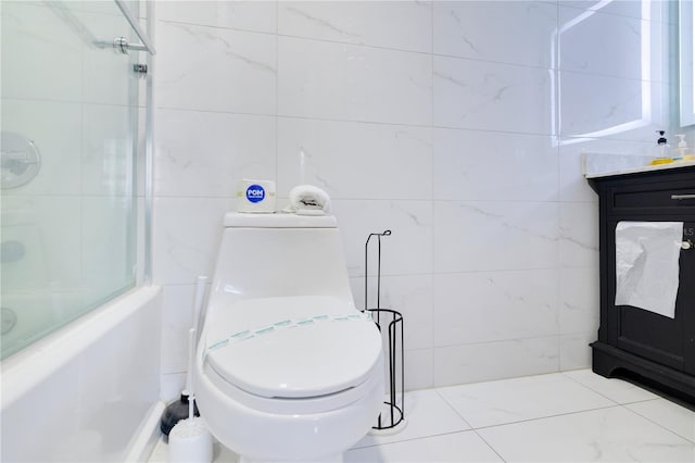 6165 Carrier Dr Unit 2605, Orlando, FL 32819 - full bathroom with tile walls, toilet, shower / bath combination, and vanity