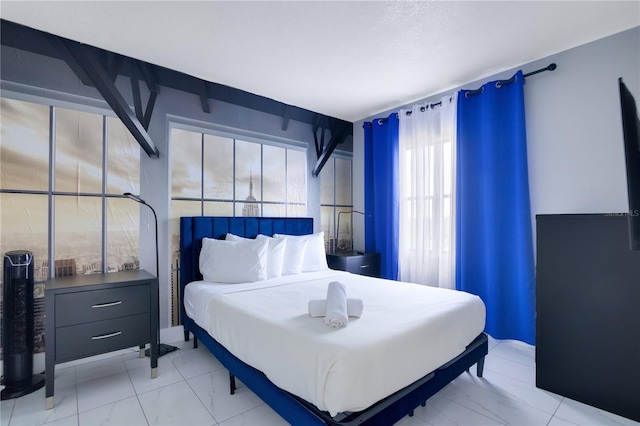 6165 Carrier Dr Unit 2605, Orlando, FL 32819 - bedroom with light marble finish flooring