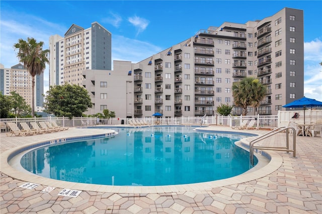 6165 Carrier Dr Unit 2605, Orlando, FL 32819 - community pool with a patio area