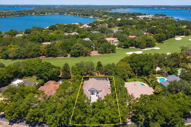 5199 Latrobe Dr, Windermere, FL 34786 - aerial overview of property's location with a golf course, a nearby body of water, property parcel outlined, and a tree filled landscape