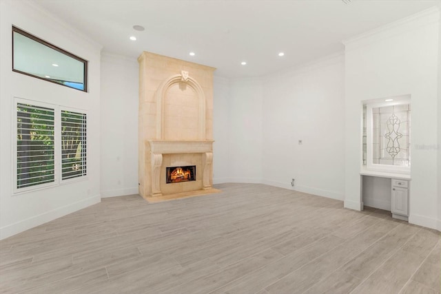 5199 Latrobe Dr, Windermere, FL 34786 - unfurnished living room with crown molding, a premium fireplace, recessed lighting, light wood-style flooring, and baseboards