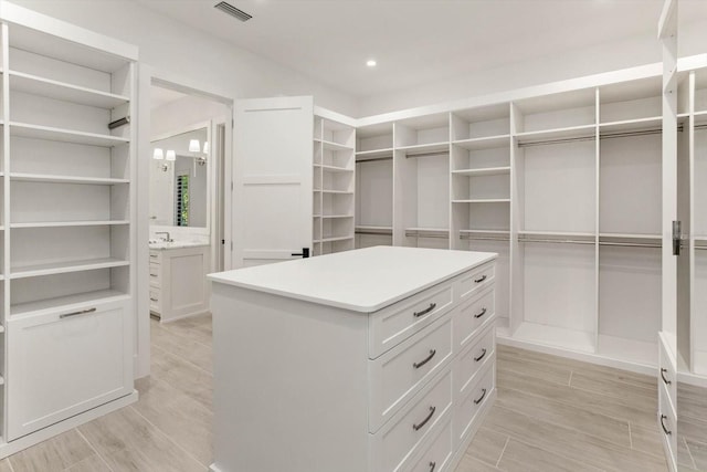 5199 Latrobe Dr, Windermere, FL 34786 - spacious closet featuring light wood-style floors