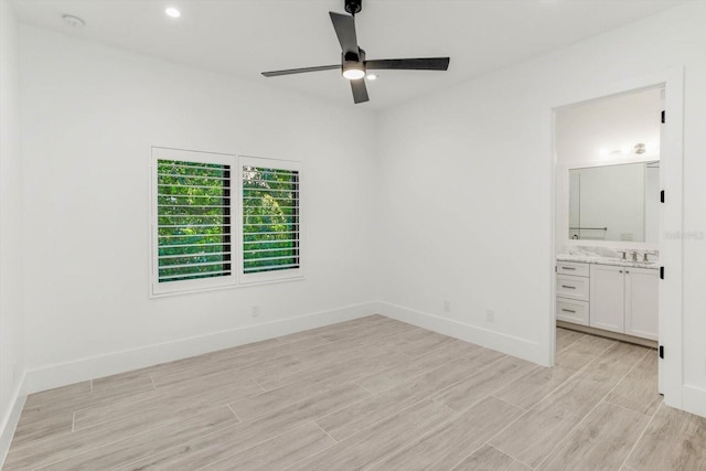 5199 Latrobe Dr, Windermere, FL 34786 - unfurnished bedroom featuring light wood-style flooring, baseboards, ensuite bath, and recessed lighting