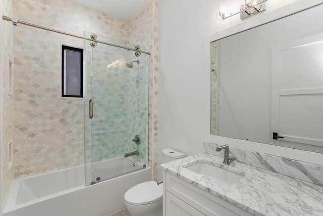 5199 Latrobe Dr, Windermere, FL 34786 - bathroom featuring toilet, vanity, and bath / shower combo with glass door