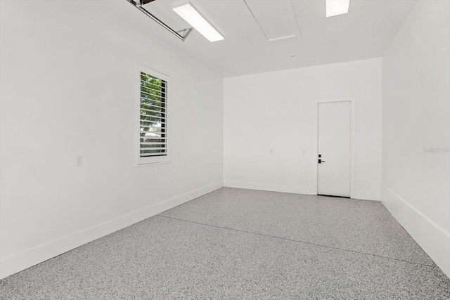 5199 Latrobe Dr, Windermere, FL 34786 - spare room featuring speckle patterned floor and baseboards