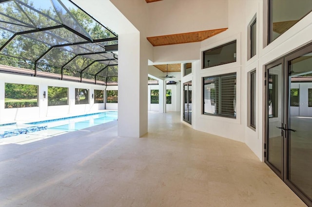 5199 Latrobe Dr, Windermere, FL 34786 - outdoor pool with ceiling fan, a patio, and glass enclosure