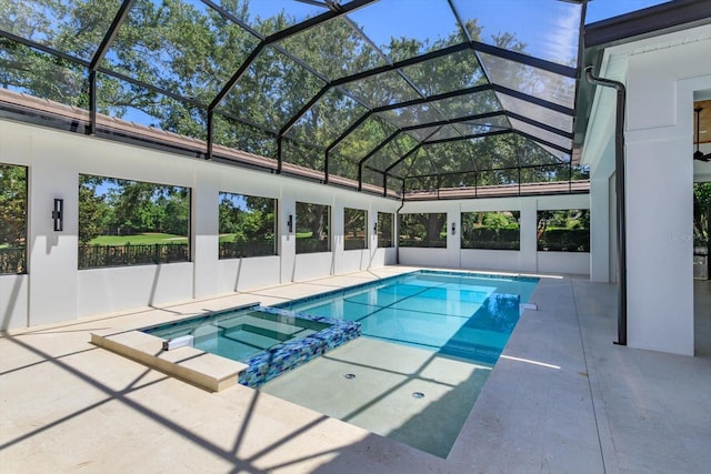 5199 Latrobe Dr, Windermere, FL 34786 - view of pool featuring a pool with connected hot tub, a patio, and a lanai