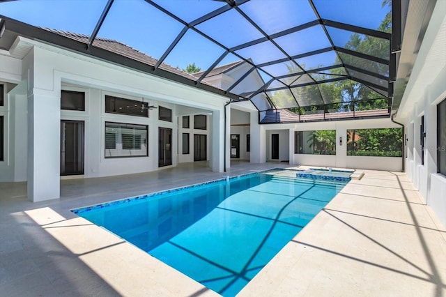 5199 Latrobe Dr, Windermere, FL 34786 - view of pool featuring a patio, a pool with connected hot tub, and glass enclosure
