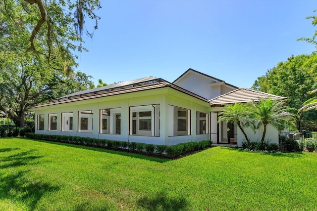 5199 Latrobe Dr, Windermere, FL 34786 - rear view of house with a yard and stucco siding