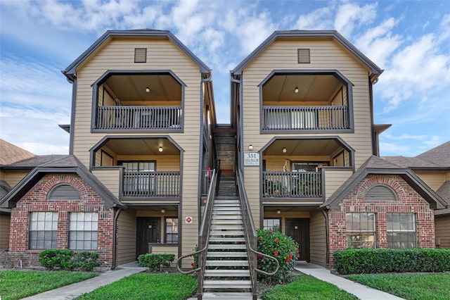 351 Lone Hill Dr Unit 206, Altamonte Springs, FL 32701 - townhome / multi-family property with stairs, a balcony, and brick siding