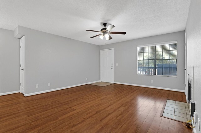 351 Lone Hill Dr Unit 206, Altamonte Springs, FL 32701 - unfurnished living room featuring a ceiling fan, wood finished floors, a textured ceiling, and baseboards