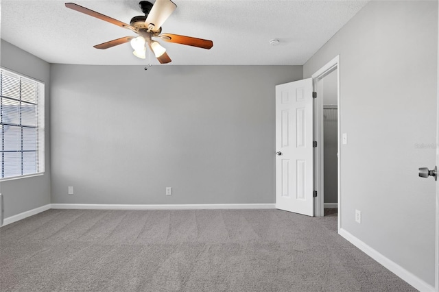 351 Lone Hill Dr Unit 206, Altamonte Springs, FL 32701 - carpeted empty room featuring a ceiling fan, baseboards, a textured ceiling, and a smoke detector