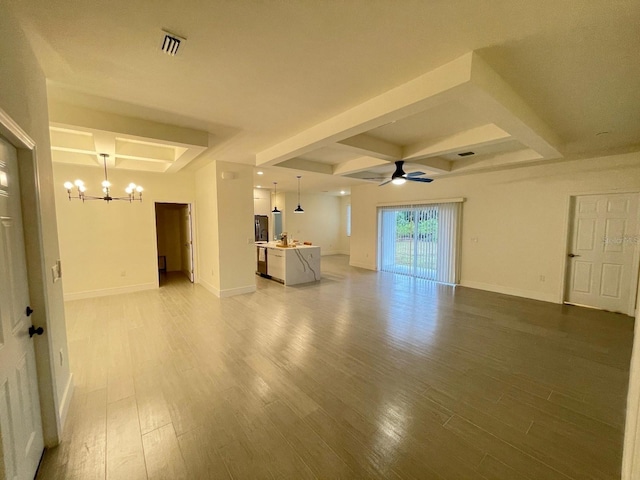 10153 Wildcat St, Port Charlotte, FL 33981 - unfurnished living room with a chandelier, beamed ceiling, light wood-style floors, a ceiling fan, and baseboards