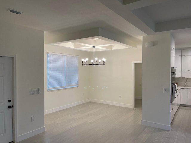 10153 Wildcat St, Port Charlotte, FL 33981 - unfurnished dining area with light wood finished floors, a chandelier, and baseboards