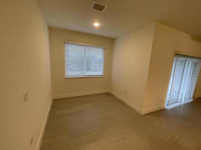 10153 Wildcat St, Port Charlotte, FL 33981 - empty room with baseboards, plenty of natural light, and recessed lighting