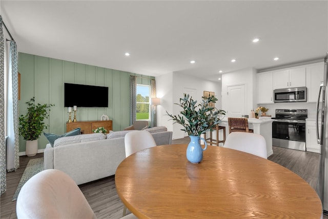 3345 Thicket St, Tavares, FL 32778 - dining room with wood finished floors, recessed lighting, and baseboards