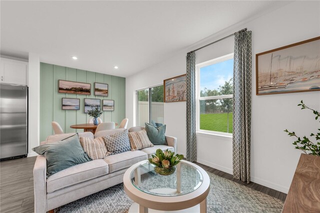 3345 Thicket St, Tavares, FL 32778 - living room with light wood-style flooring, recessed lighting, and baseboards