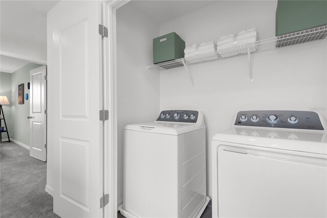 3345 Thicket St, Tavares, FL 32778 - laundry area featuring washer and clothes dryer, carpet floors, and baseboards