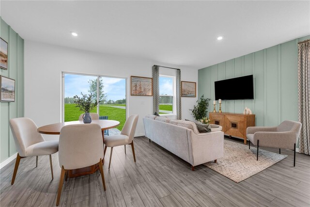 3345 Thicket St, Tavares, FL 32778 - living area featuring light wood-style flooring, recessed lighting, and a decorative wall