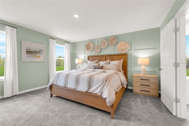 3345 Thicket St, Tavares, FL 32778 - bedroom featuring carpet floors, baseboards, and a decorative wall