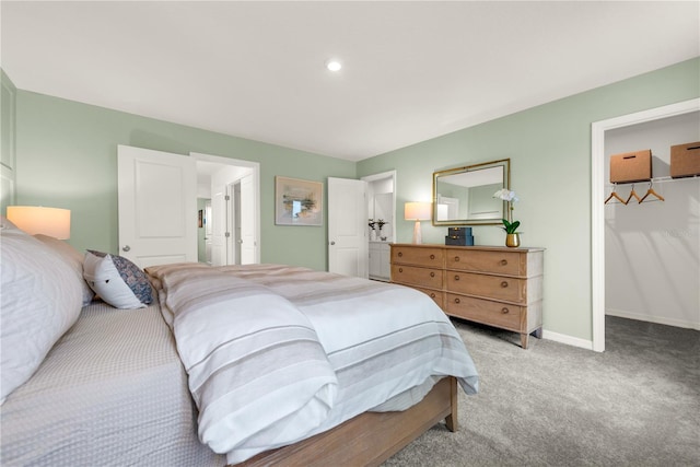 3345 Thicket St, Tavares, FL 32778 - bedroom with light colored carpet, a walk in closet, baseboards, and a closet